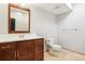 Bathroom featuring single sink vanity, toilet, and tile floor at 13071 Emerson St, Thornton, CO 80241