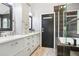 Bathroom with double vanity, modern fixtures, and a shower at 13071 Emerson St, Thornton, CO 80241