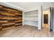 Bedroom featuring hardwood floors and built in shelves at 13071 Emerson St, Thornton, CO 80241