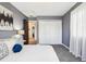 Bedroom featuring a cozy bed, closet doors, and windows, creating a comfortable space at 13071 Emerson St, Thornton, CO 80241