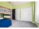 Bedroom featuring bunk beds, carpet, and a closet that enhances the functionality of the space at 13071 Emerson St, Thornton, CO 80241