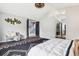 Main bedroom featuring an accent wall decoration, a walk-in closet, and a cozy seating area at 13071 Emerson St, Thornton, CO 80241