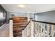 Hallway features a wooden accent wall and a view of the living room at 13071 Emerson St, Thornton, CO 80241