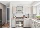 Contemporary kitchen with a stainless steel range, granite countertops, and subway tile backsplash at 13071 Emerson St, Thornton, CO 80241