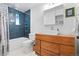 Modern bathroom with stylish vanity, vessel sink, and blue-tiled shower at 7550 Stuart St, Westminster, CO 80030