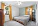 Comfortable bedroom with two windows and a ceiling fan at 7550 Stuart St, Westminster, CO 80030