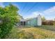 Backyard view of the cozy home with a well-maintained lawn and a covered patio area at 7550 Stuart St, Westminster, CO 80030