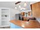 Functional kitchen featuring stainless steel appliances, breakfast bar, and wood countertops offering ample space at 7550 Stuart St, Westminster, CO 80030