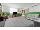 Comfortable living room features neutral colors, plush carpeting, and a large window with natural light at 7550 Stuart St, Westminster, CO 80030