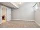 Unfinished basement with neutral carpet and white trim offers potential for customization at 3527 W 44Th Ave, Denver, CO 80211
