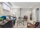 Finished basement with modern furniture, neutral colors, and ample seating at 3527 W 44Th Ave, Denver, CO 80211