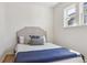 Minimalist bedroom with a queen bed, simple decor, and natural light at 3527 W 44Th Ave, Denver, CO 80211