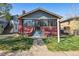 Charming brick home with a cozy front porch and well-maintained lawn on a sunny day at 3527 W 44Th Ave, Denver, CO 80211
