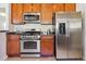 Well-equipped kitchen features stainless steel appliances and granite countertops at 3527 W 44Th Ave, Denver, CO 80211