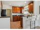 Well-lit kitchen featuring granite countertops, ample cabinet space, and a convenient breakfast bar at 3527 W 44Th Ave, Denver, CO 80211