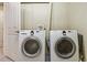 Convenient laundry area featuring a side-by-side washer and dryer at 3527 W 44Th Ave, Denver, CO 80211