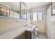 Bathroom featuring a vanity with granite countertops, a tile floor, and a window at 2630 Albion St, Denver, CO 80207