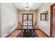 Elegant dining room with hardwood floors, chandelier, and ample natural light at 2630 Albion St, Denver, CO 80207