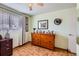 Bedroom includes dresser and decor at 6436 Otis St, Arvada, CO 80003