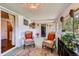 Cozy sun room with comfortable seating, decorative accents, and ample natural light at 6436 Otis St, Arvada, CO 80003