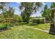 Expansive backyard with a wooden fence, a lush lawn, and plenty of space for gardening at 180 S Lamar St, Lakewood, CO 80226