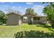 Spacious backyard showing the home's exterior and lush greenery in a serene setting at 180 S Lamar St, Lakewood, CO 80226