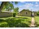 Charming single-story home with a well-maintained lawn and a pathway to the entrance at 180 S Lamar St, Lakewood, CO 80226