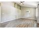 Bright living room featuring vaulted ceilings, wood-look flooring, and a ceiling fan at 180 S Lamar St, Lakewood, CO 80226