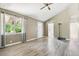 Inviting living room with wood-look floors and a large window, perfect for relaxing or entertaining at 180 S Lamar St, Lakewood, CO 80226
