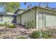 Inviting home exterior with landscaped walkway leading to a charming purple front door at 547 S Flower St, Lakewood, CO 80226