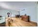 Bright living room with hardwood floors and dining area at 547 S Flower St, Lakewood, CO 80226