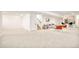 Spacious finished basement area with seating and dry bar at 8230 W Tennessee Ct, Lakewood, CO 80226