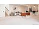 Finished basement area features a seating area and bar with modern lighting fixtures, great for entertaining guests at 8230 W Tennessee Ct, Lakewood, CO 80226