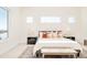 Bright bedroom with large windows, stylish decor, and cozy natural light at 8230 W Tennessee Ct, Lakewood, CO 80226