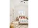 Vaulted bedroom with a patterned rug, natural decor and great natural light at 8230 W Tennessee Ct, Lakewood, CO 80226