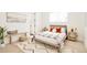 Bright bedroom with modern decor, a patterned rug, and ample natural light from a large window at 8230 W Tennessee Ct, Lakewood, CO 80226