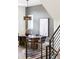 Contemporary dining room with oval table, decorative rug, and modern lighting fixture at 8230 W Tennessee Ct, Lakewood, CO 80226