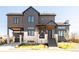 Stunning modern exterior showcases unique architectural details and professional landscaping at 8230 W Tennessee Ct, Lakewood, CO 80226
