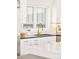 Kitchen featuring a black sink, stainless steel dishwasher and gold cabinet pulls at 8230 W Tennessee Ct, Lakewood, CO 80226