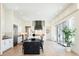 Gourmet kitchen featuring a large island, stainless appliances, and an abundance of natural light at 8230 W Tennessee Ct, Lakewood, CO 80226