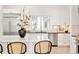 Kitchen showcasing white countertops, backsplash design, and stainless steel appliances at 8230 W Tennessee Ct, Lakewood, CO 80226