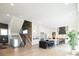 Large living space with a chef's kitchen and access to a staircase and lower level at 8230 W Tennessee Ct, Lakewood, CO 80226