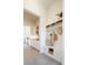 Inviting mudroom with built-in bench seating, storage cubbies, and access to the kitchen at 8230 W Tennessee Ct, Lakewood, CO 80226