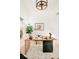 Bright home office with a modern wooden desk, unique marble accents, and an elegant decor at 8230 W Tennessee Ct, Lakewood, CO 80226