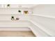 Walk-in pantry with ample shelving, providing plentiful storage and organization at 8230 W Tennessee Ct, Lakewood, CO 80226