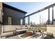 Outdoor patio with lounge seating and wood decking for comfortable entertaining at 8230 W Tennessee Ct, Lakewood, CO 80226
