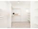 Walk-in closet with ample shelving and rod space for organized storage at 8230 W Tennessee Ct, Lakewood, CO 80226
