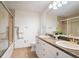 Bathroom with double sink vanity, granite countertops, and glass enclosed shower at 5677 S Park Pl # B310, Englewood, CO 80111