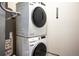 Stacked Samsung washer and dryer appliances are featured in this home's laundry area at 5677 S Park Pl # B310, Englewood, CO 80111