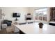 Cozy living room featuring a fireplace and kitchen with an open concept layout at 5677 S Park Pl # B310, Englewood, CO 80111